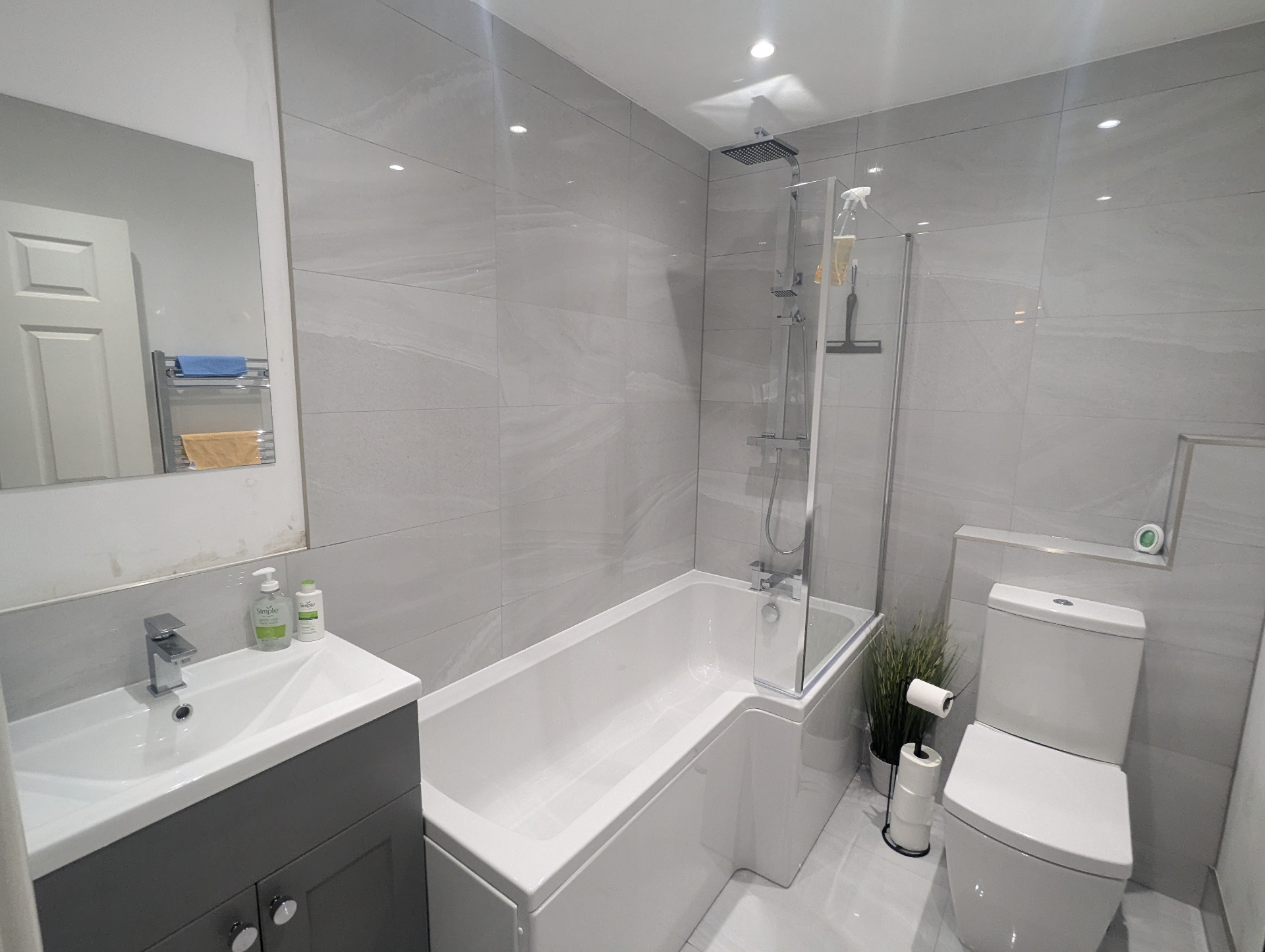 Grey bathroom with walk-in shower