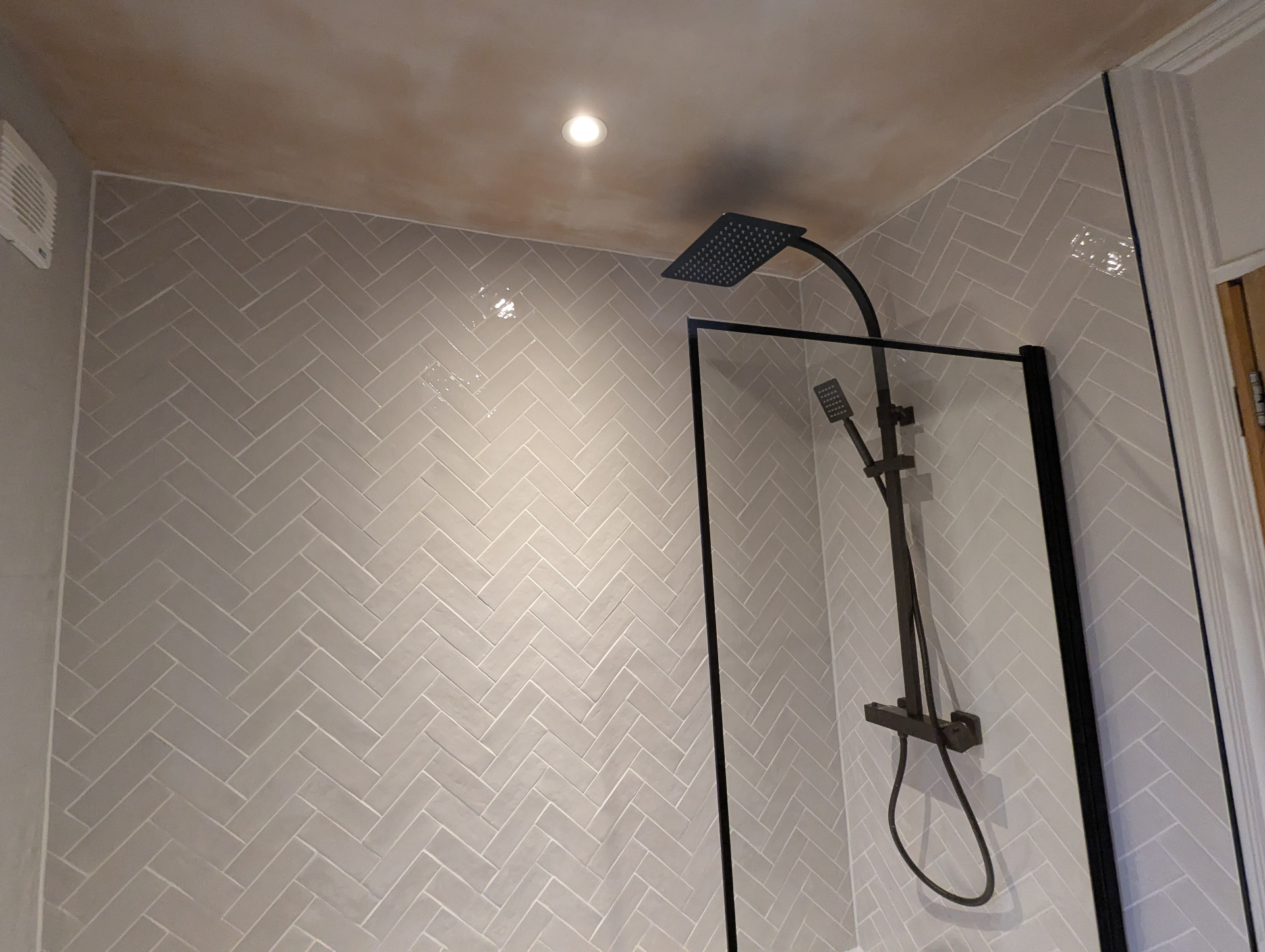 Bathroom with herringbone tile pattern