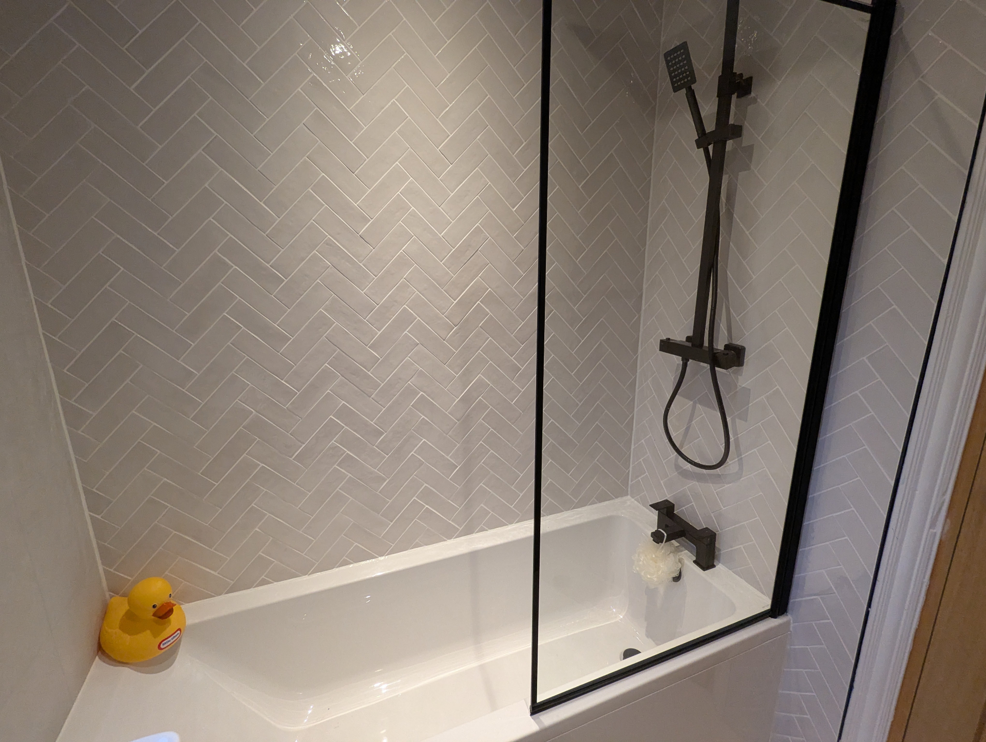 Herringbone tiled shower room