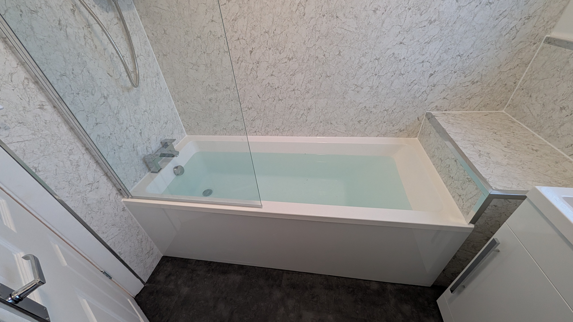 Professional plumber fixing kitchen tap