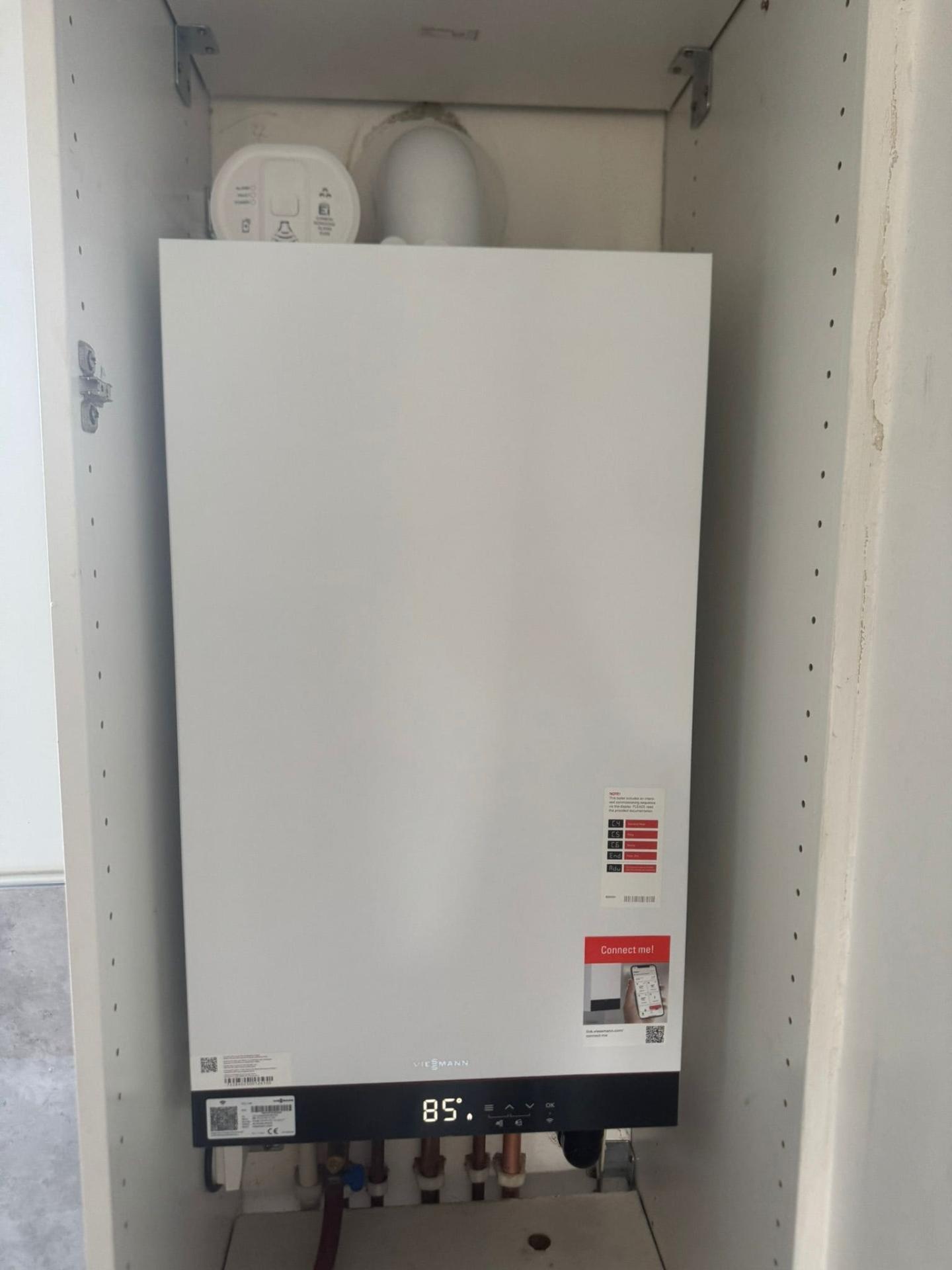 Viessmann boiler fitted inside white cupboard